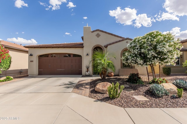 805 E Ln Palta St, Queen Creek, AZ 85140 - mediterranean / spanish-style home featuring concrete driveway, an attached garage, stucco siding, and a tiled roof