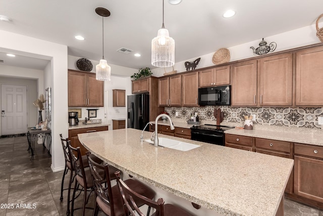 805 E Ln Palta St, Queen Creek, AZ 85140 - kitchen with backsplash, visible vents, black appliances, and a sink