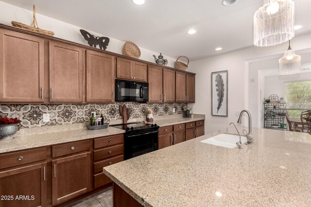 805 E Ln Palta St, Queen Creek, AZ 85140 - kitchen with recessed lighting, hanging light fixtures, a sink, backsplash, and black appliances