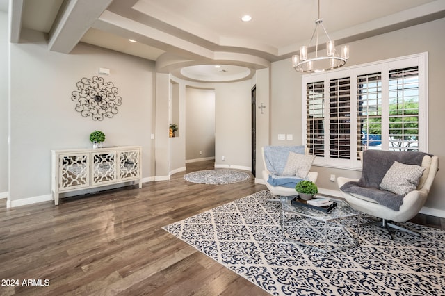 sitting room featuring a notable chandelier and hardwood / wood-style flooring