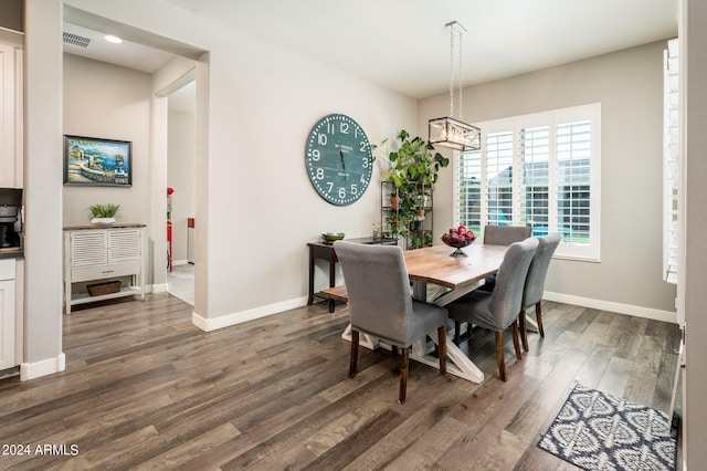 dining space featuring dark hardwood / wood-style flooring