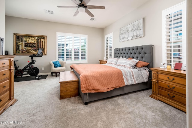 carpeted bedroom with ceiling fan