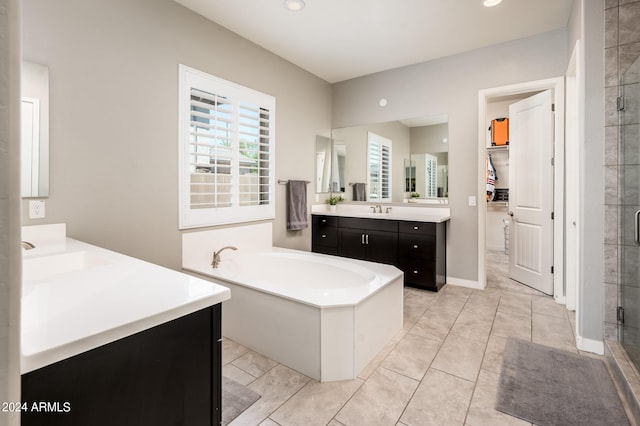 bathroom with independent shower and bath and vanity