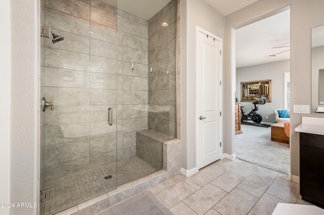 bathroom with vanity, a shower with door, and tile patterned floors