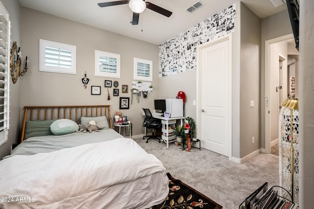 bedroom featuring ceiling fan and light colored carpet