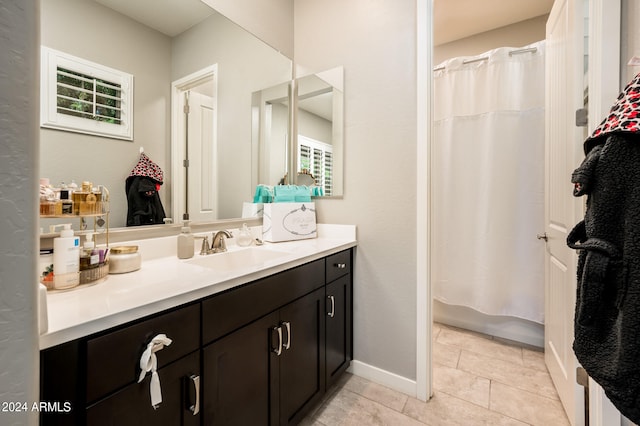 bathroom with shower / tub combo and vanity