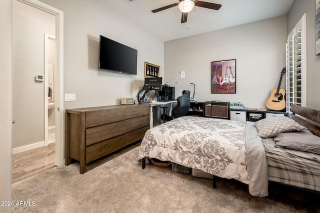 bedroom with ceiling fan and wood-type flooring