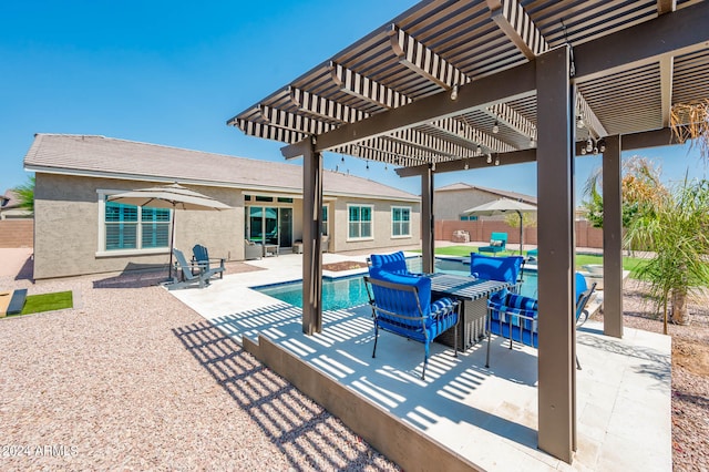 view of patio with a pergola and a fenced in pool