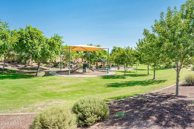 view of community with a playground and a yard