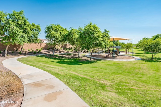 view of community with a playground and a lawn