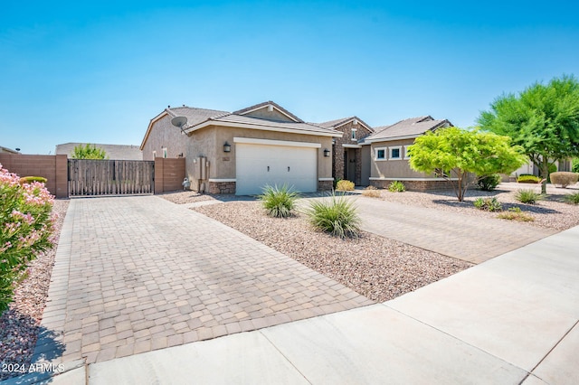 ranch-style home featuring a garage