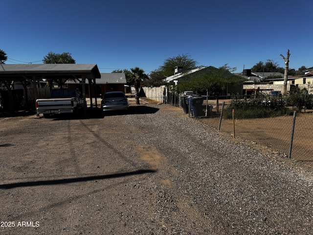 219 W Frye Rd, Chandler, AZ 85225 - view of yard featuring dirt driveway and a detached carport