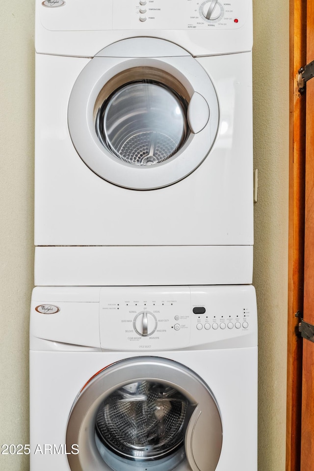 laundry area with stacked washer / dryer