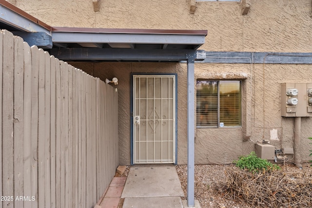 property entrance with fence