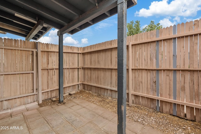 view of patio / terrace featuring fence