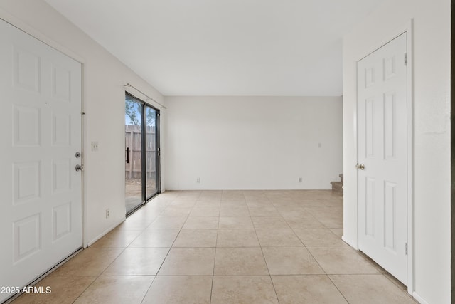 entryway with light tile patterned floors