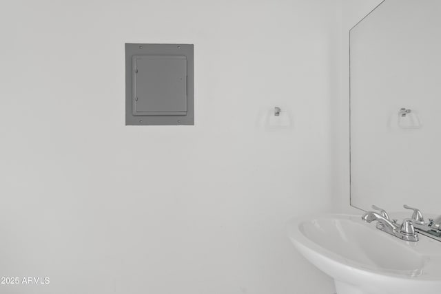 bathroom featuring a sink and electric panel
