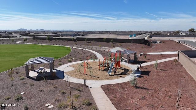 view of yard with a playground, a gazebo, and a mountain view