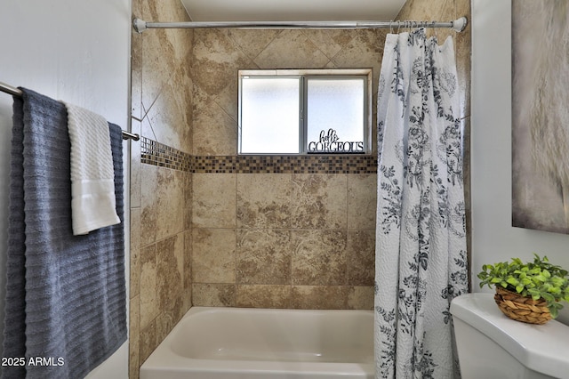 full bathroom featuring shower / bath combination with curtain and toilet