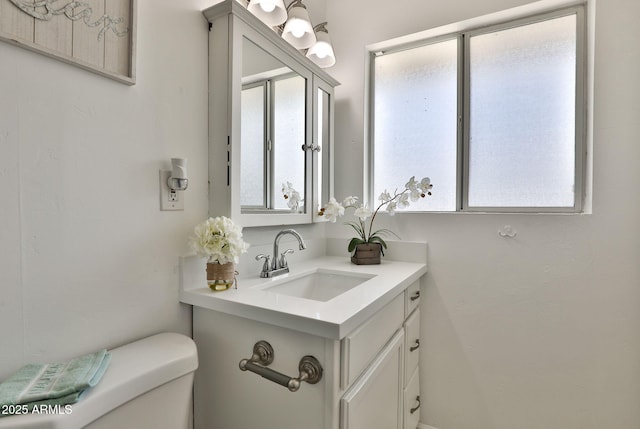 half bath with vanity and toilet