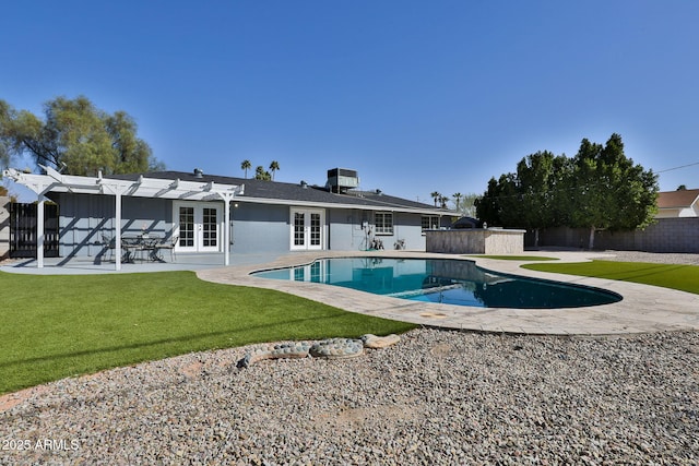 rear view of property with french doors, a yard, central AC unit, a patio area, and a fenced backyard