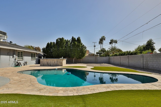 view of pool featuring a fenced backyard, a lawn, a fenced in pool, and a patio