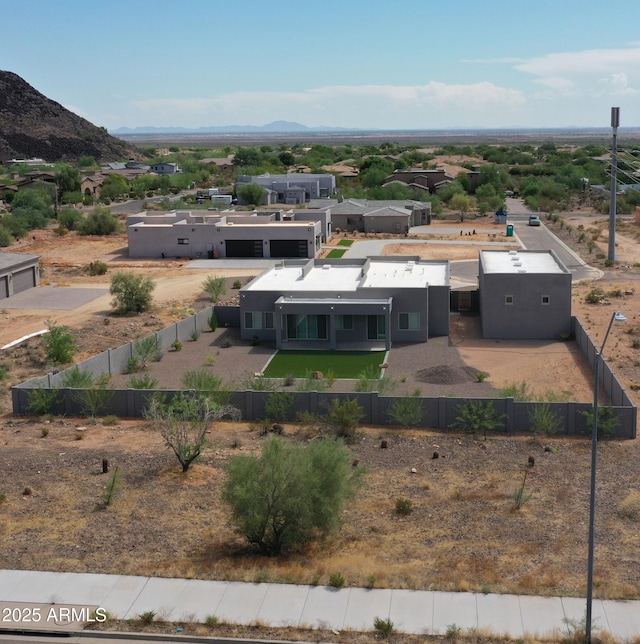 birds eye view of property with a mountain view