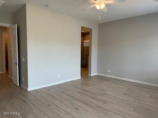 unfurnished room with ceiling fan and light hardwood / wood-style flooring