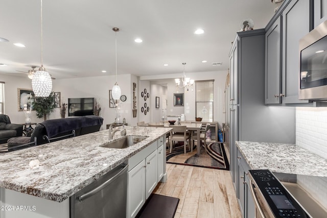 dining space featuring light hardwood / wood-style floors and a notable chandelier