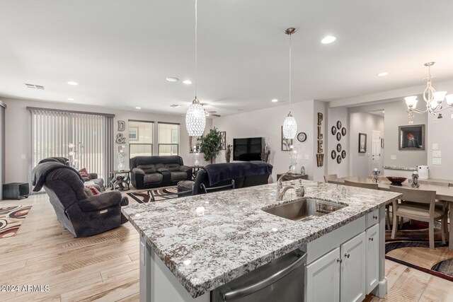 kitchen featuring gray cabinets, tasteful backsplash, sink, hanging light fixtures, and stainless steel appliances