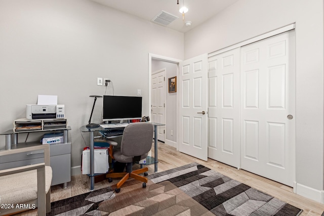 bathroom featuring vanity, a shower with shower door, and tile patterned flooring