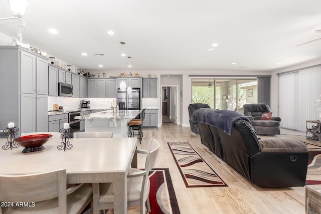 dining area featuring a chandelier and light hardwood / wood-style floors