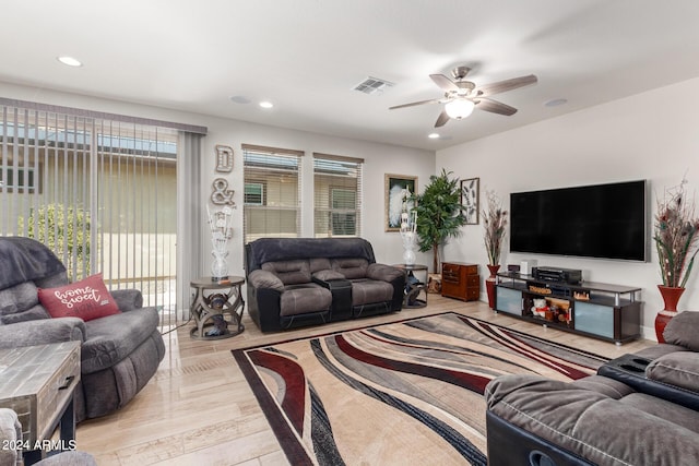 living room with ceiling fan and light wood-type flooring