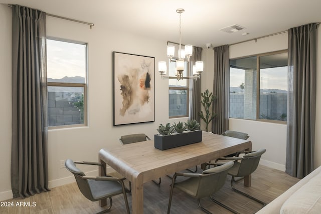 dining space with a notable chandelier