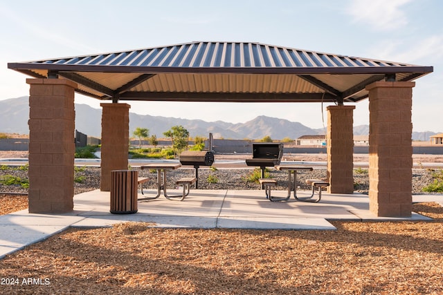 surrounding community featuring a gazebo and a mountain view