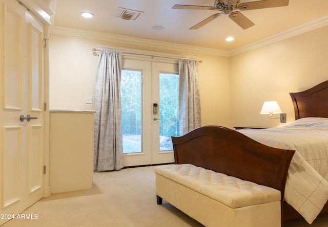 carpeted bedroom with ceiling fan, crown molding, and french doors