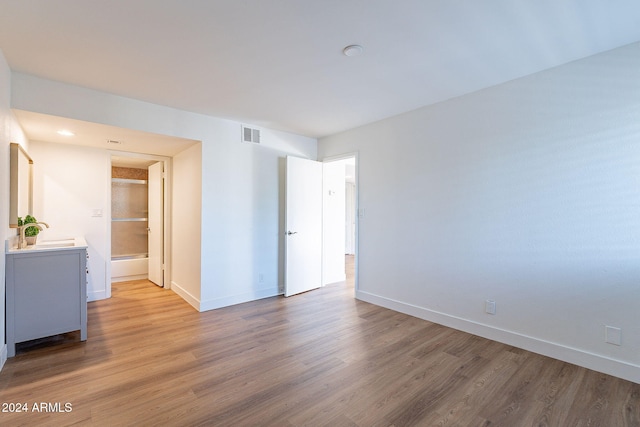 empty room featuring hardwood / wood-style flooring