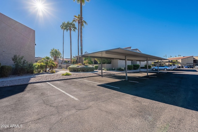 view of vehicle parking with a carport