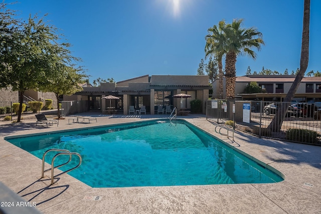 view of swimming pool featuring a patio