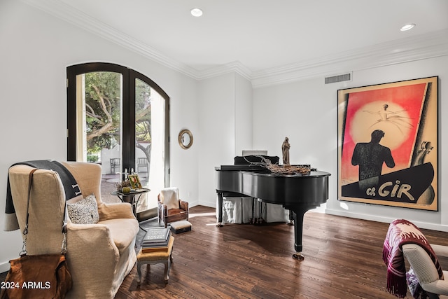 sitting room with dark hardwood / wood-style floors, ornamental molding, and french doors