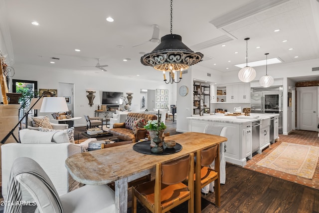 dining room featuring ceiling fan, dark hardwood / wood-style floors, and ornamental molding