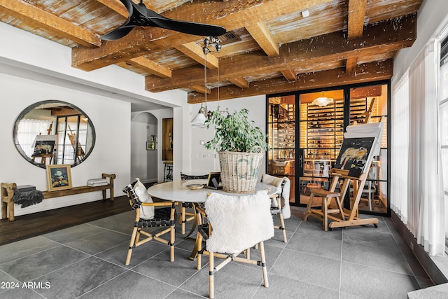 tiled dining room with beamed ceiling and wood ceiling