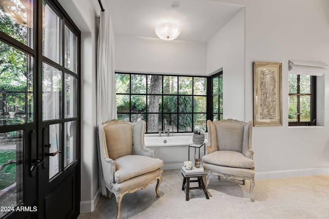 sitting room with tile patterned flooring