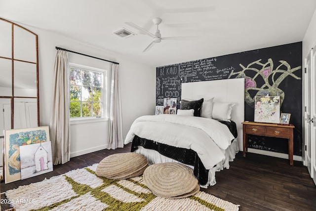 bedroom featuring ceiling fan and dark hardwood / wood-style floors