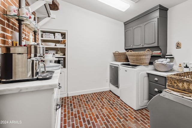 laundry room with cabinets and separate washer and dryer