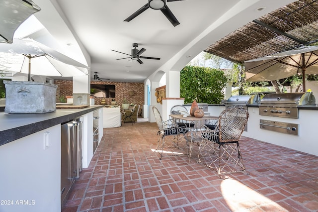 view of patio / terrace featuring a grill and exterior kitchen