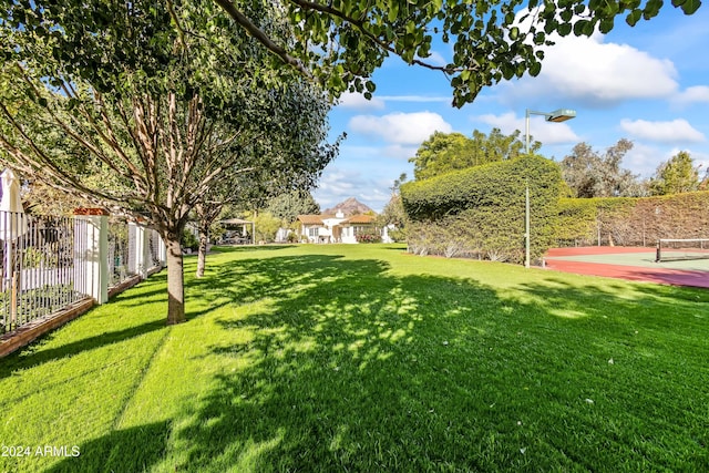 view of yard featuring tennis court