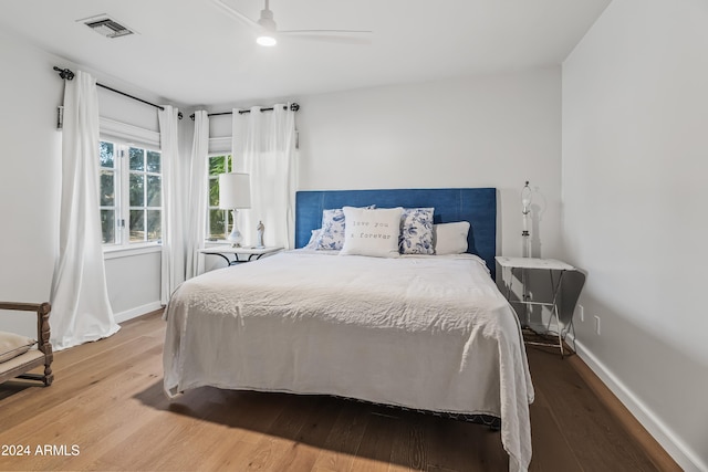 bedroom featuring hardwood / wood-style flooring and ceiling fan