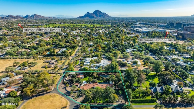 birds eye view of property with a mountain view