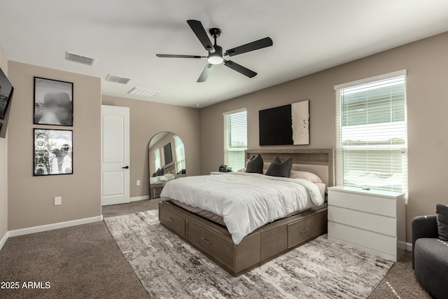 bedroom featuring light carpet, visible vents, and baseboards